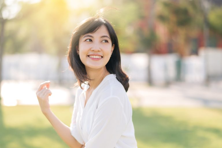 a young asian woman smiling